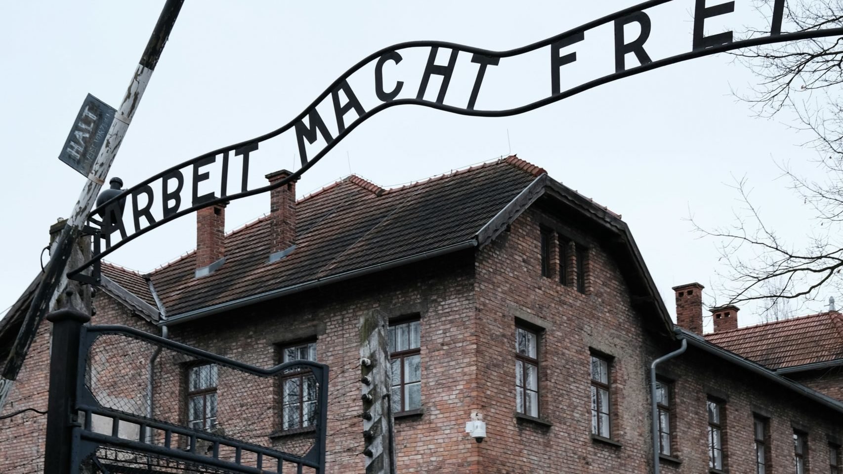 The main gate with the sign “Arbeit Macht Frei” (“Work makes you free”) of the Museum of Auschwitz.