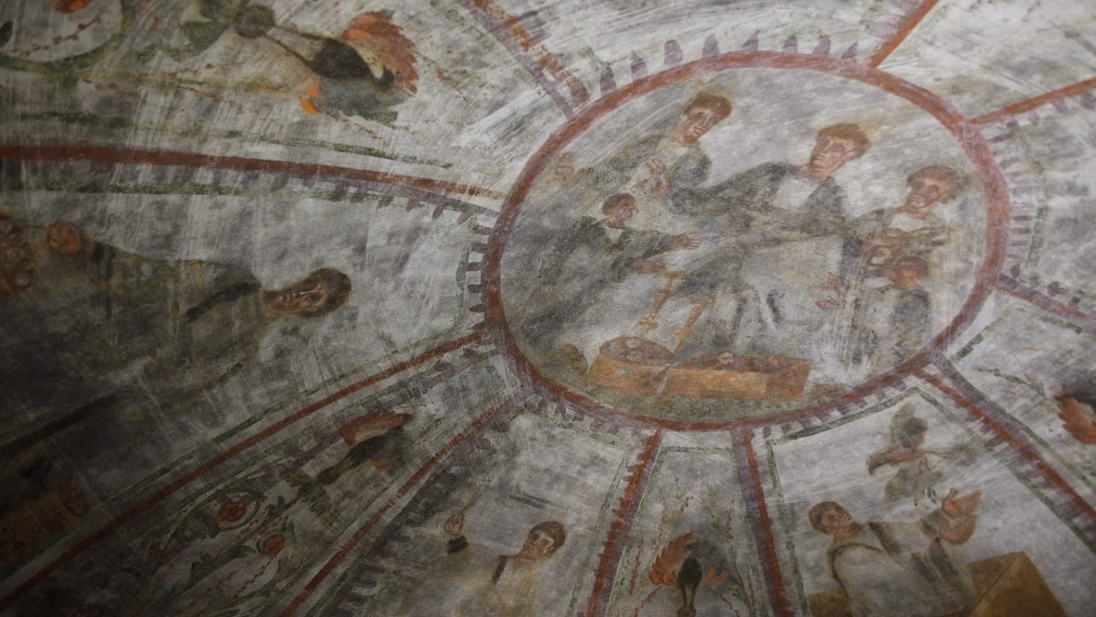 A fresco showing Noah releasing doves, lower right, and other scenes representing salvation are seen during the unveiling of two newly restored burial chambers in the Christian catacombs of St. Domitilla in Rome May 30, 2017. The Catacombs of St. Domitilla are believed to be the world's oldest Christian cemetery. (CNS photo/Carol Glatz)