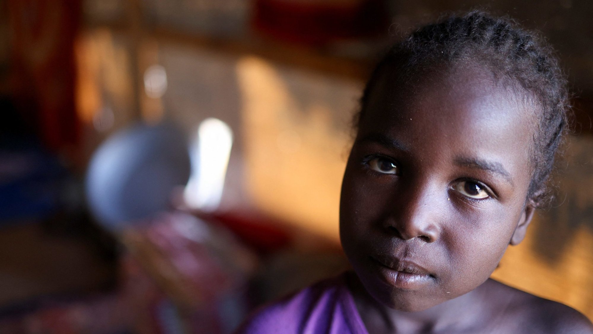 Mnasoura Mostafa, 6, a Sudanese refugee from al-Fashir, looks on inside her tent at the Tine transit refugee camp in eastern Chad, Nov. 22, 2025. Mnasoura dreams of eating food in her home, far from the conflict in Sudan, amid ongoing fighting between the paramilitary Rapid Support Forces and the Sudanese army. (OSV News photo/Amr Abdallah Dalsh, Reuters)