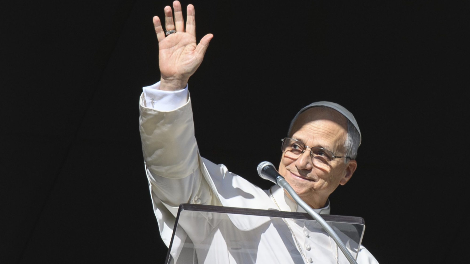 Pope Leo XIV greets visitors in St. Peter's Square at the Vatican as they gather to pray the Angelus prayer on the feast of the Holy Family, Dec. 28, 2025. (CNS photo/Vatican Media)