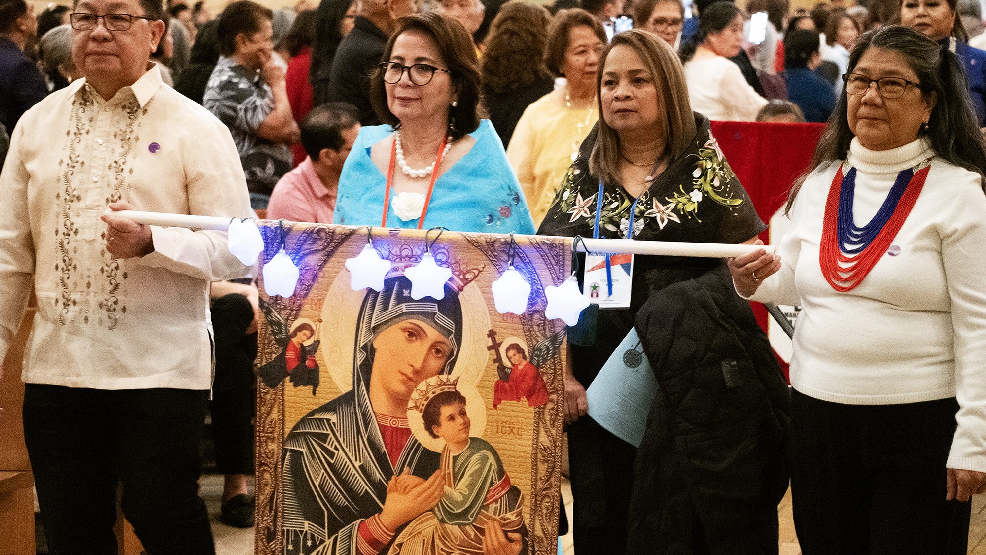 LA Catholics process into the Cathedral of Our Lady of the Angels for the 2024 Simbang Gabi kickoff Mass. (Victor Alemán)