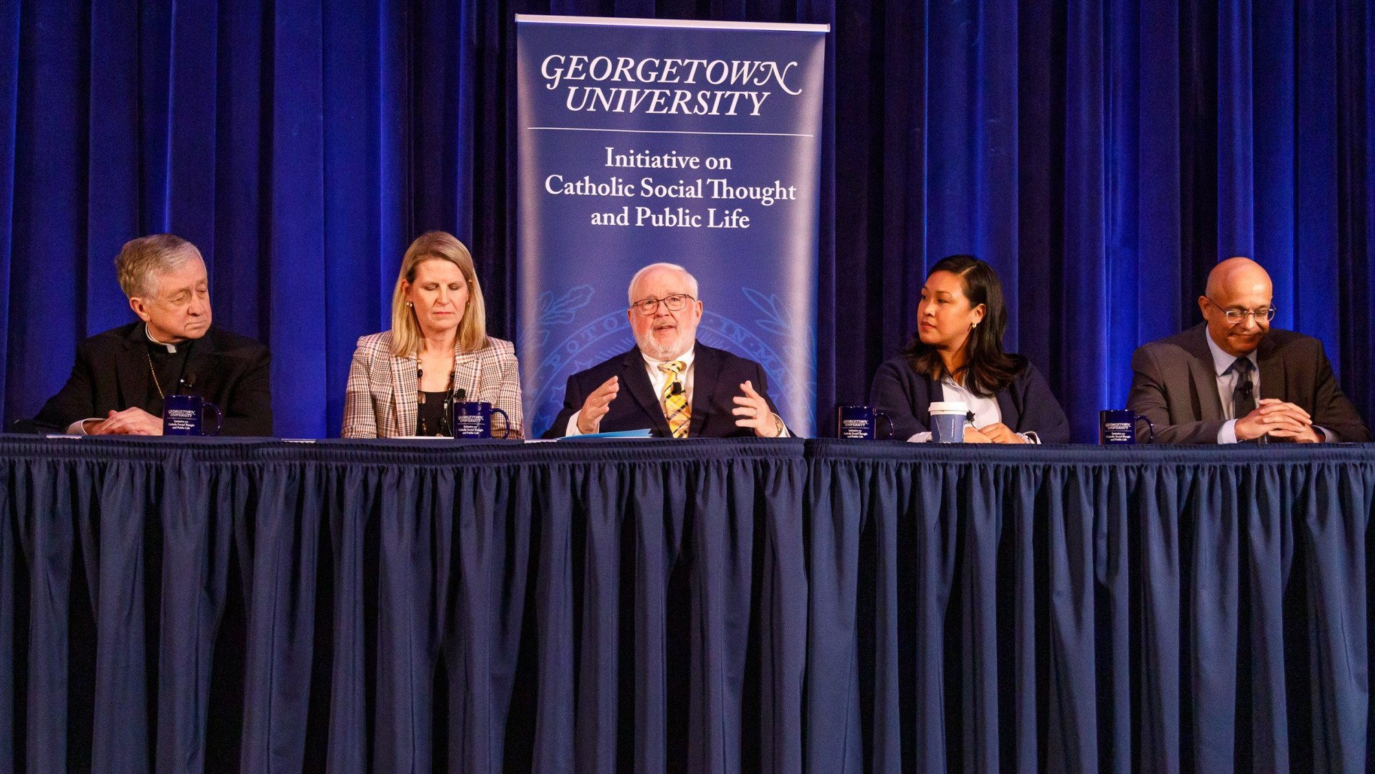 John Carr, founder of the Initiative on Catholic Social Thought and Public Life at Georgetown University, center, leads a panel discussion on "Pope Leo XIV's New Challenge and Moral Leadership on Poverty, Work, and Artificial Intelligence," at Georgetown University in Washington Oct. 30, 2025. Also pictured are Chicago Cardinal Blase J. Cupich, Liz Shuler president of AFL-CIO, Cecilia Flores, executive director of Catholic Volunteer Network, and Paul Almeida, dean and William R. Berkley Chair at Georgetown University’s McDonough School of Business. (OSV News/David Asche, courtesy Georgetown University)