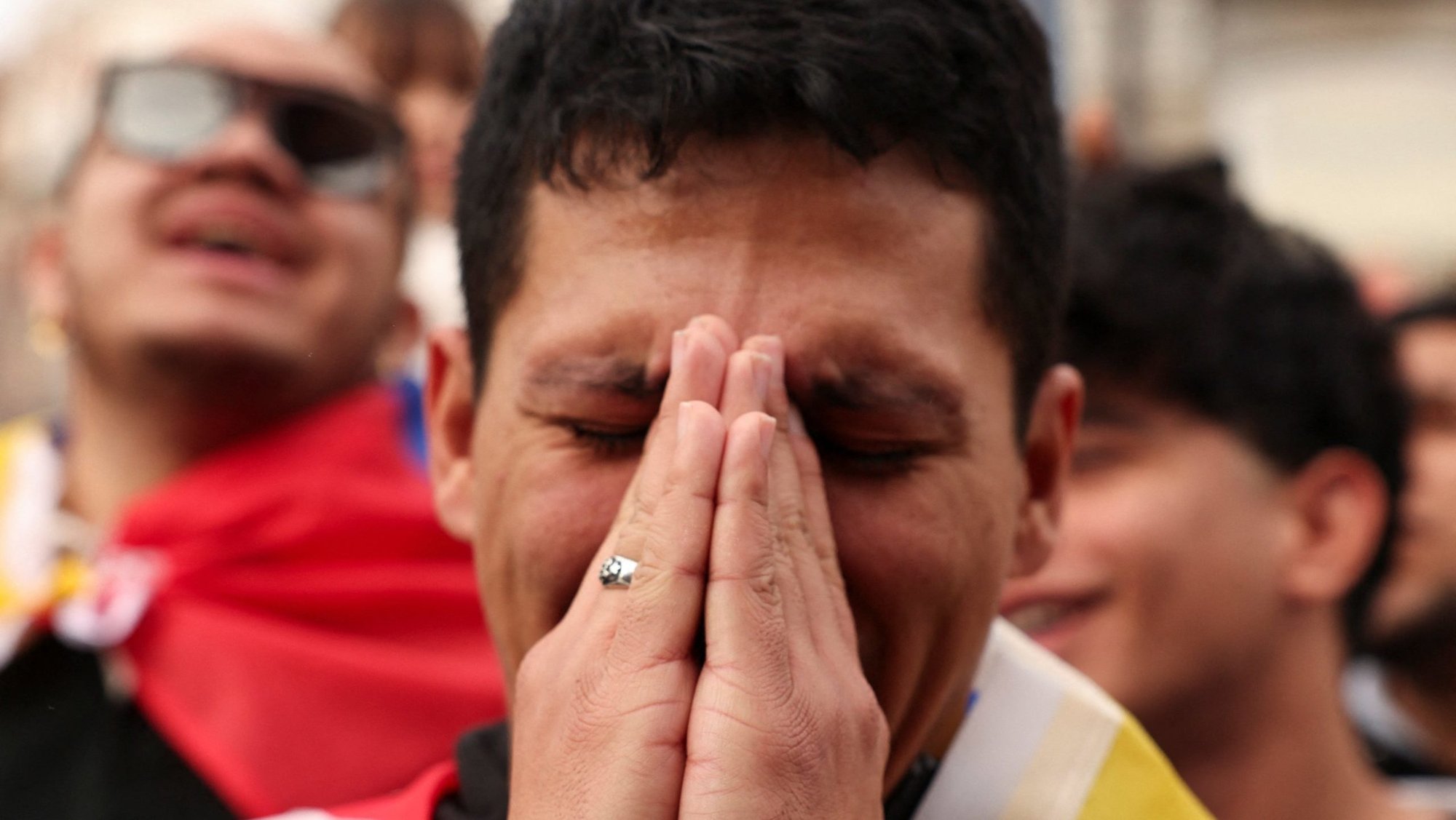 A man becomes emotional as people in Madrid celebrate Jan. 3 in reaction to the news that the U.S. had captured Venezuela’s president, Nicolas Maduro. (OSV News/Violeta Santos Moura)