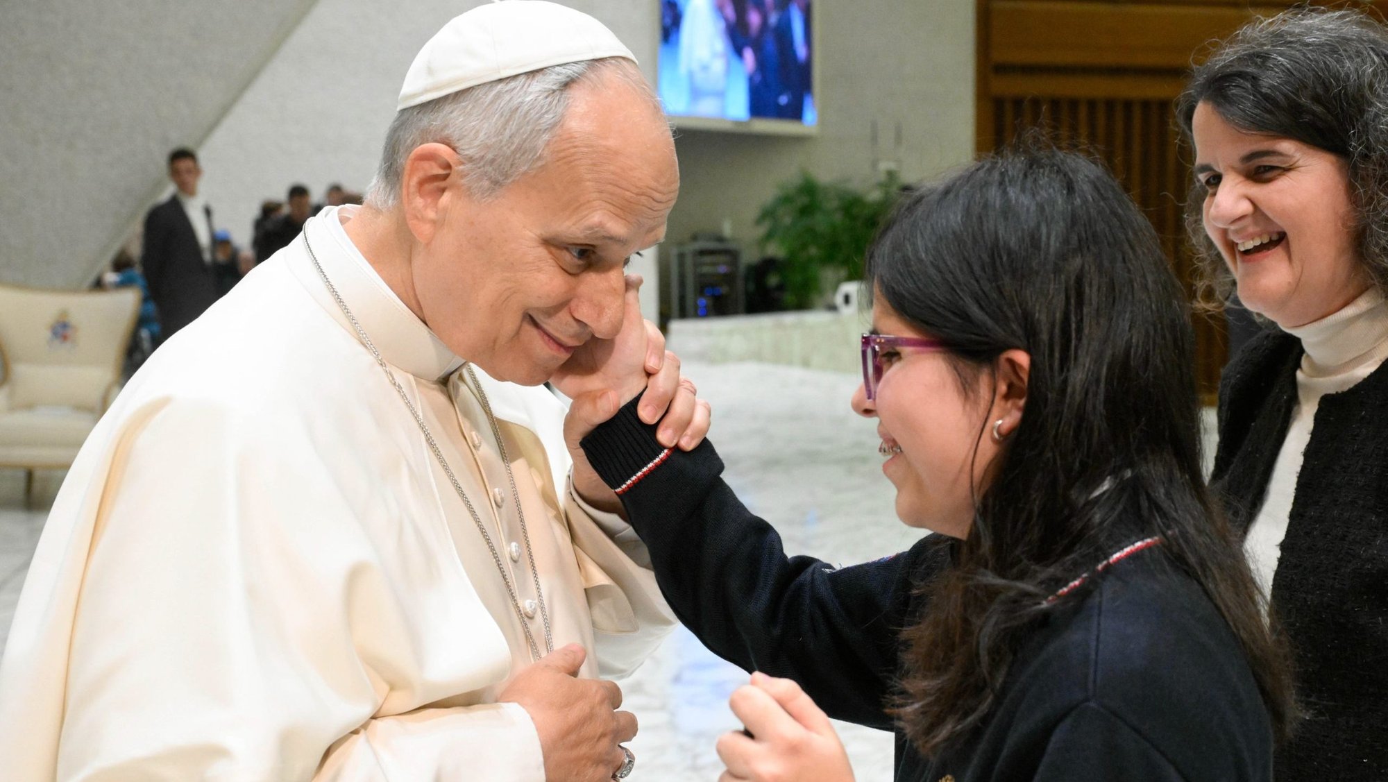 Pope Leo XIV greets people at the conclusion of his weekly general audience in the Paul VI Audience Hall at the Vatican Jan. 14, 2026. (CNS photo/Vatican Media)