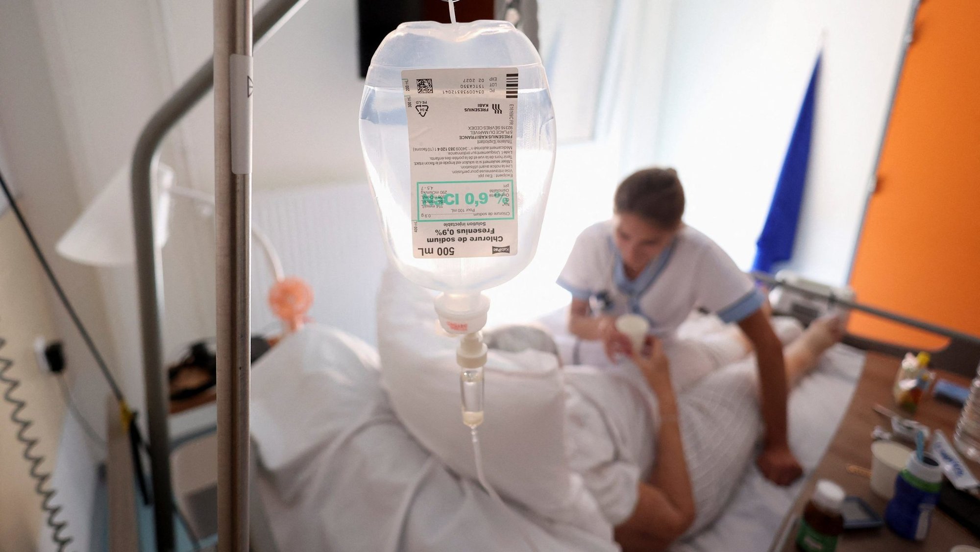 A drip bag is pictured while a nurse gives medicine to a patient at the palliative care unit of the Clinic Saint-Elisabeth in Marseille, France, May 31, 2024. On Jan. 15, 2026, French bishops reaffirmed their opposition to a bill establishing the right to "active assistance in dying," which senators will begin reviewing Jan. 20, with a vote set for Jan. 28. The National Assembly, the lower house of the French Parliament, passed the measure May 27, 2025. (OSV News photo/Manon Cruz, Reuters)