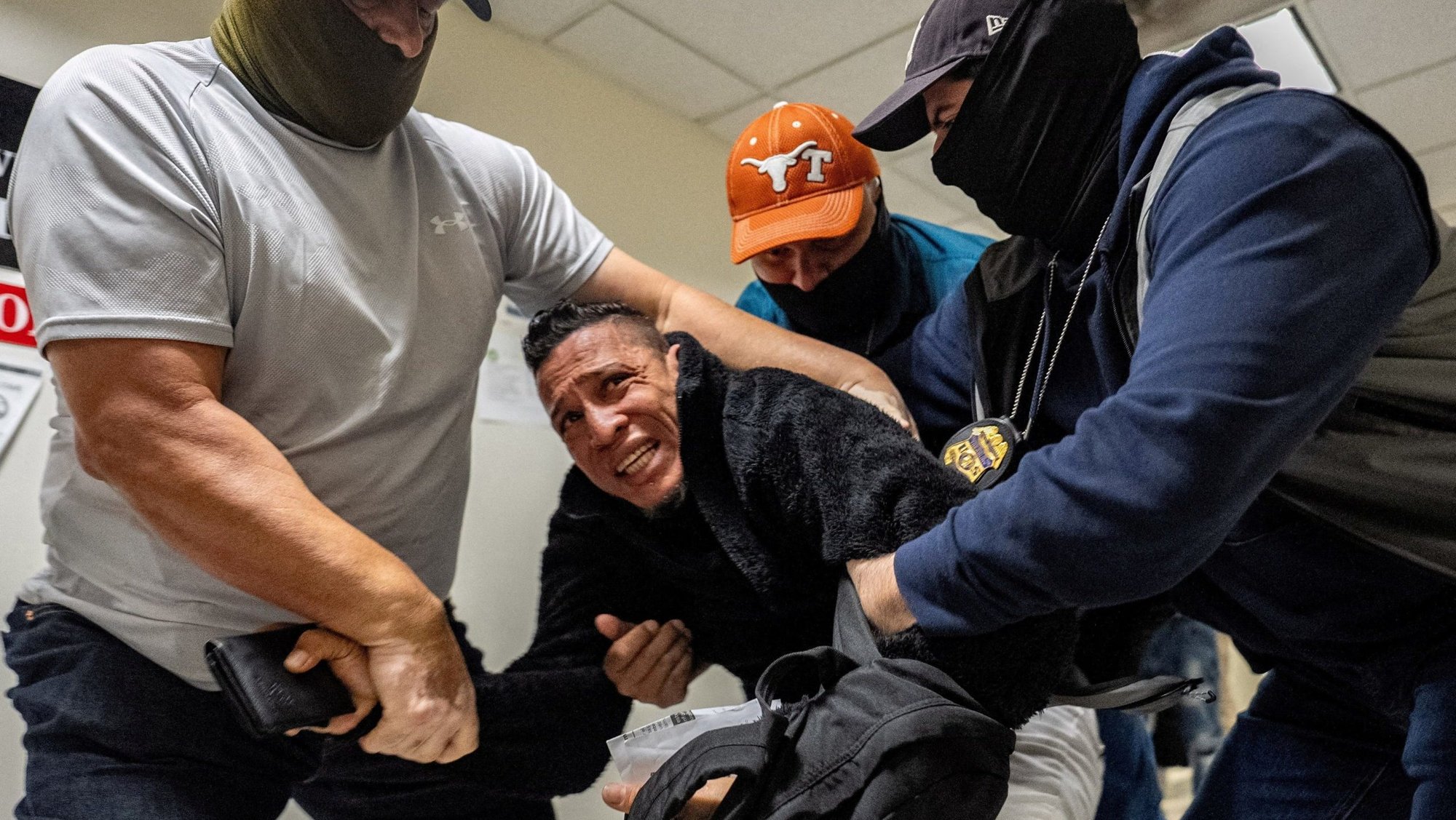 U.S. Immigration and Customs Enforcement agents and federal officers detain a migrant as he walks out from a hearing during targeted detainment at a U.S. immigration court in the Manhattan borough of New York City Oct. 27, 2025. (OSV News photo/David 'Dee' Delgado, Reuters)