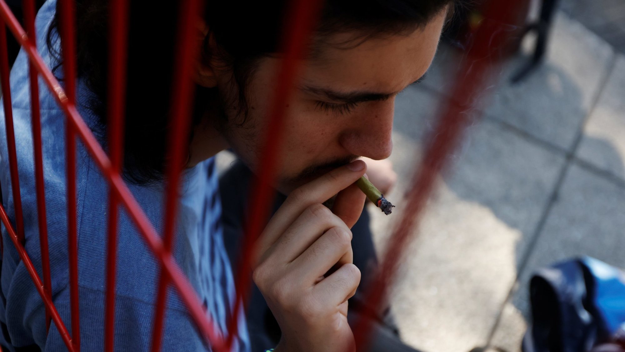 A man smokes a marijuana joint in this file photo from Nov. 19, 2020. (OSV News/Carlos Jasso, Reuters)