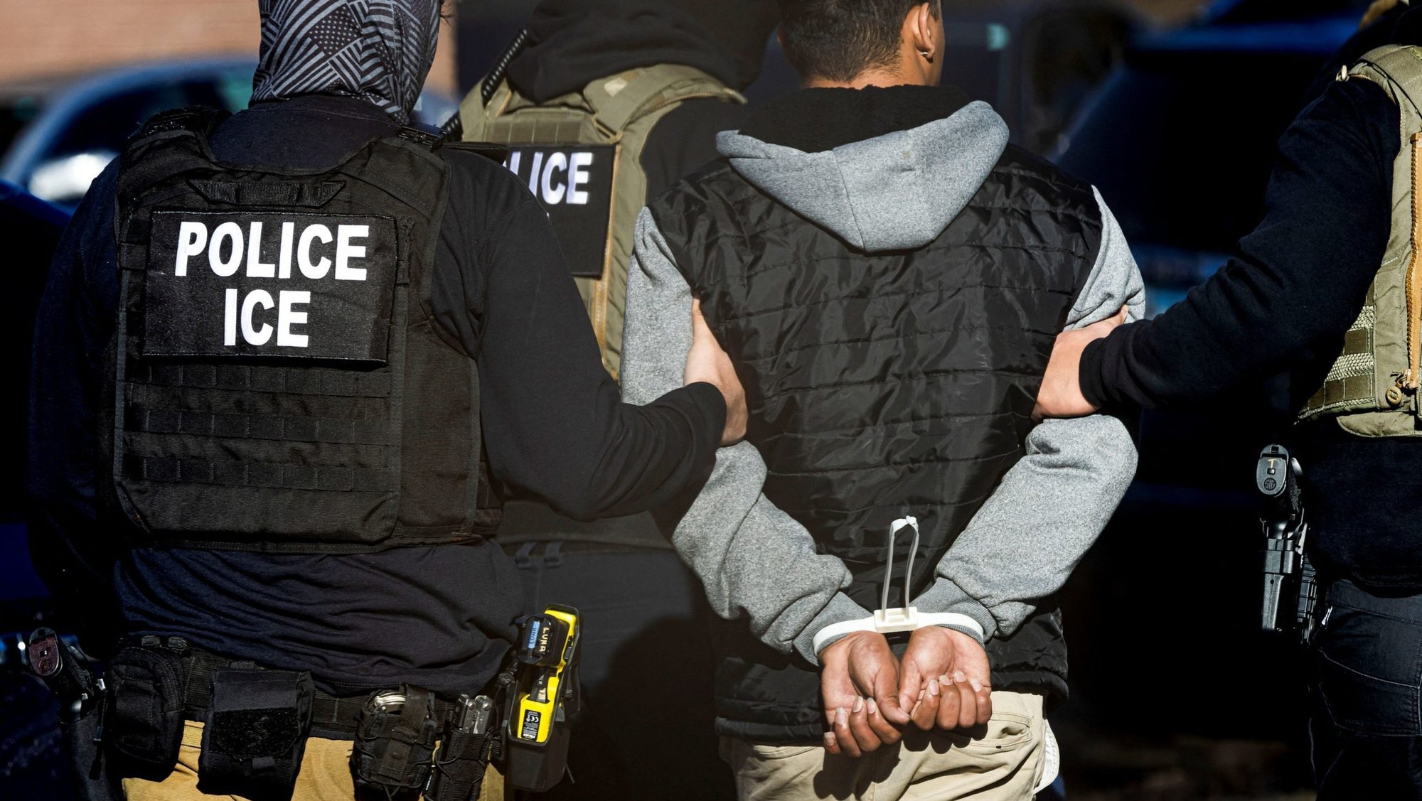 Agents with the Immigration and Customs Enforcement detain a man after conducting a raid at the Cedar Run apartment complex in Denver Feb. 5, 2025. (OSV News photo/Kevin Mohatt, Reuters)
