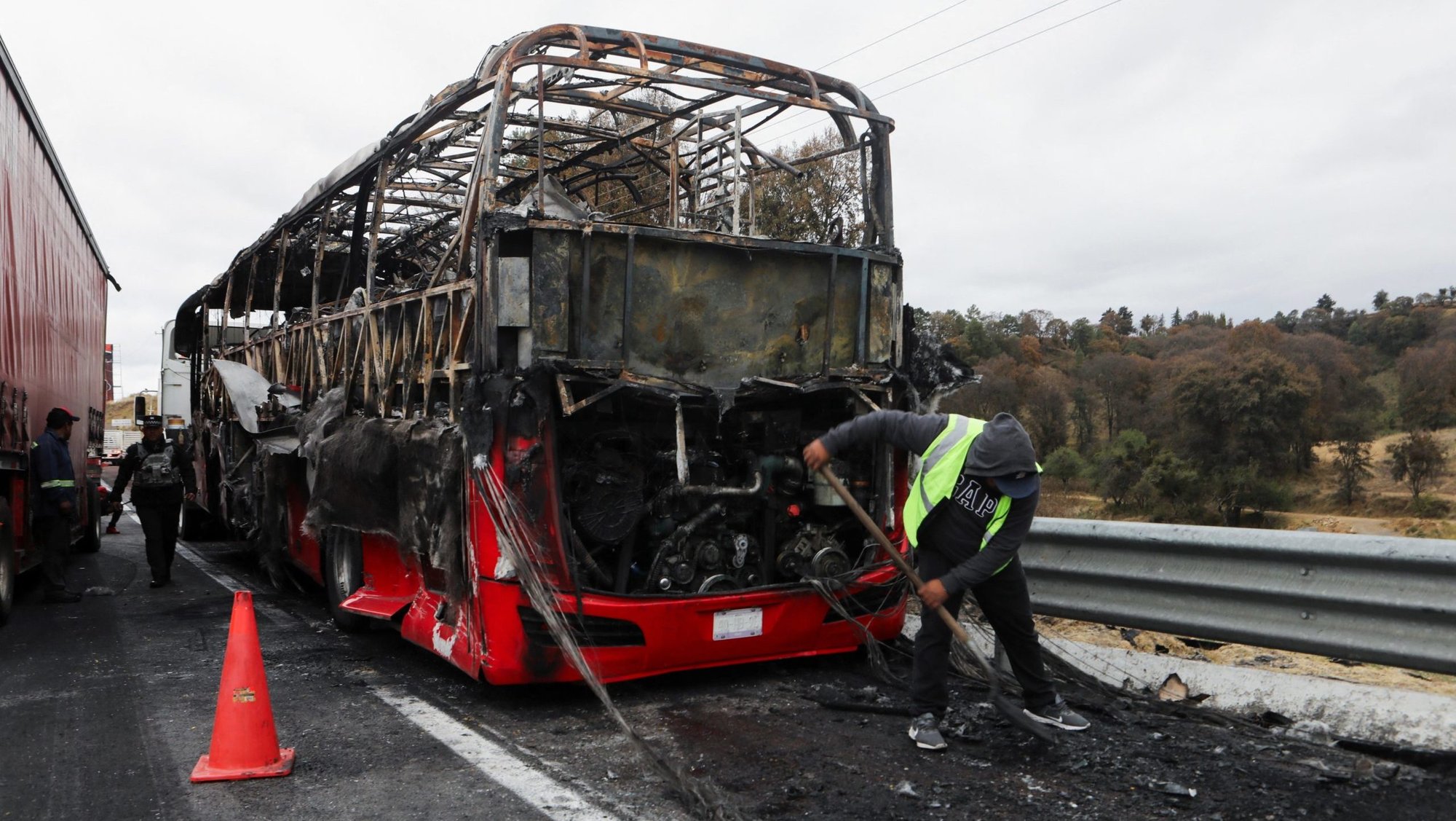 A burned bus is seen Feb. 22, 2026, at the site of a highway in Santa Rita Tlahuapan, Mexico, that connects Mexico City with the state of Puebla. Members of organized crime in several states put up roadblocks and carried out arson attacks after a military operation in which Mexican drug lord Nemesio Oseguera, known as "El Mencho," was killed in Tapalpa in Mexico's Jalisco state. (OSV News photo/Paola Garcia, Reuters)
