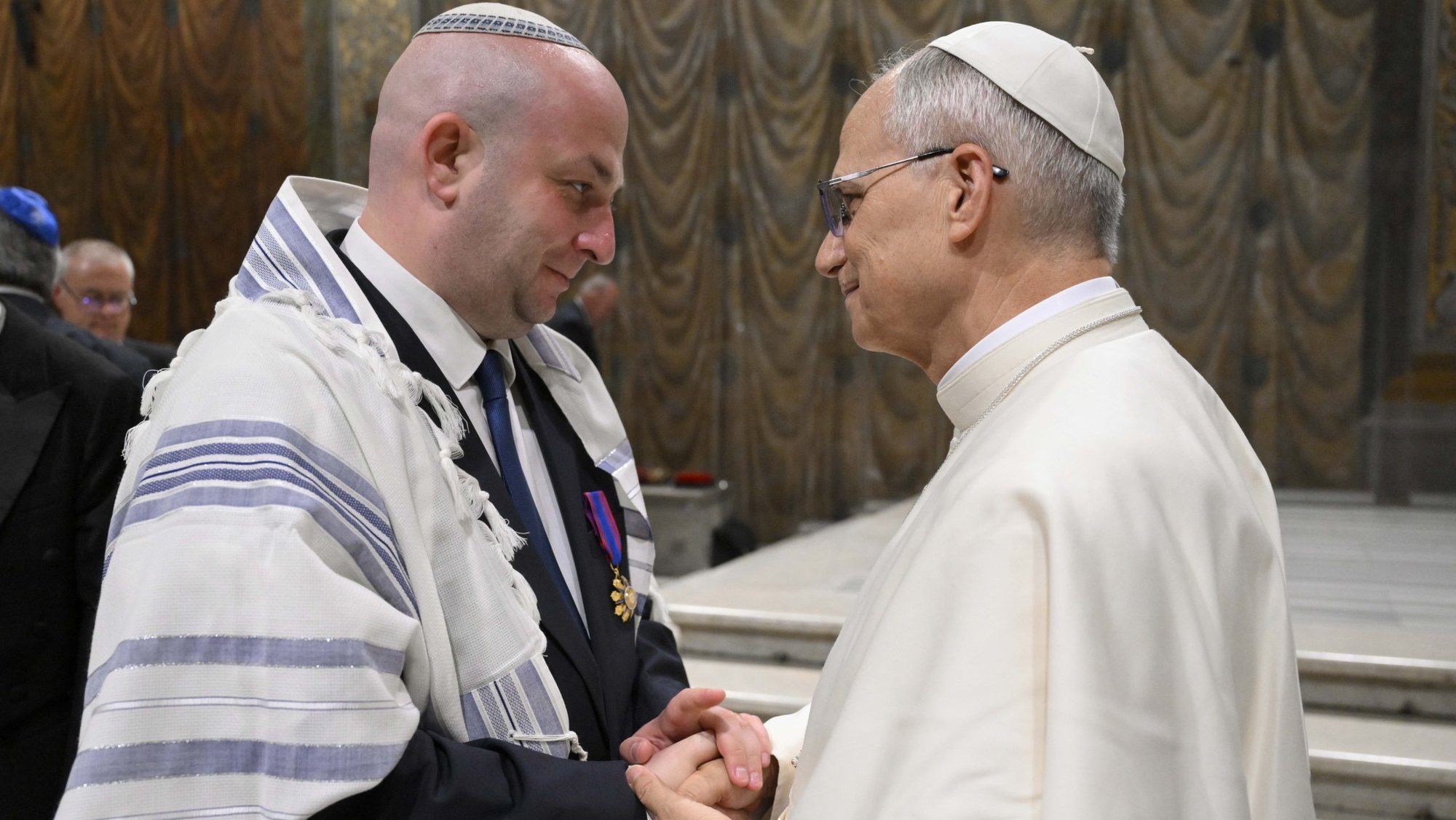 Pope Leo XIV greets Silviu Vexler, president of the Federation of Jewish Communities in Romania, during a ceremony honoring Blessed Iuliu Hossu in the Sistine Chapel at the Vatican June 2, 2025. (CNS photo/Vatican Media)