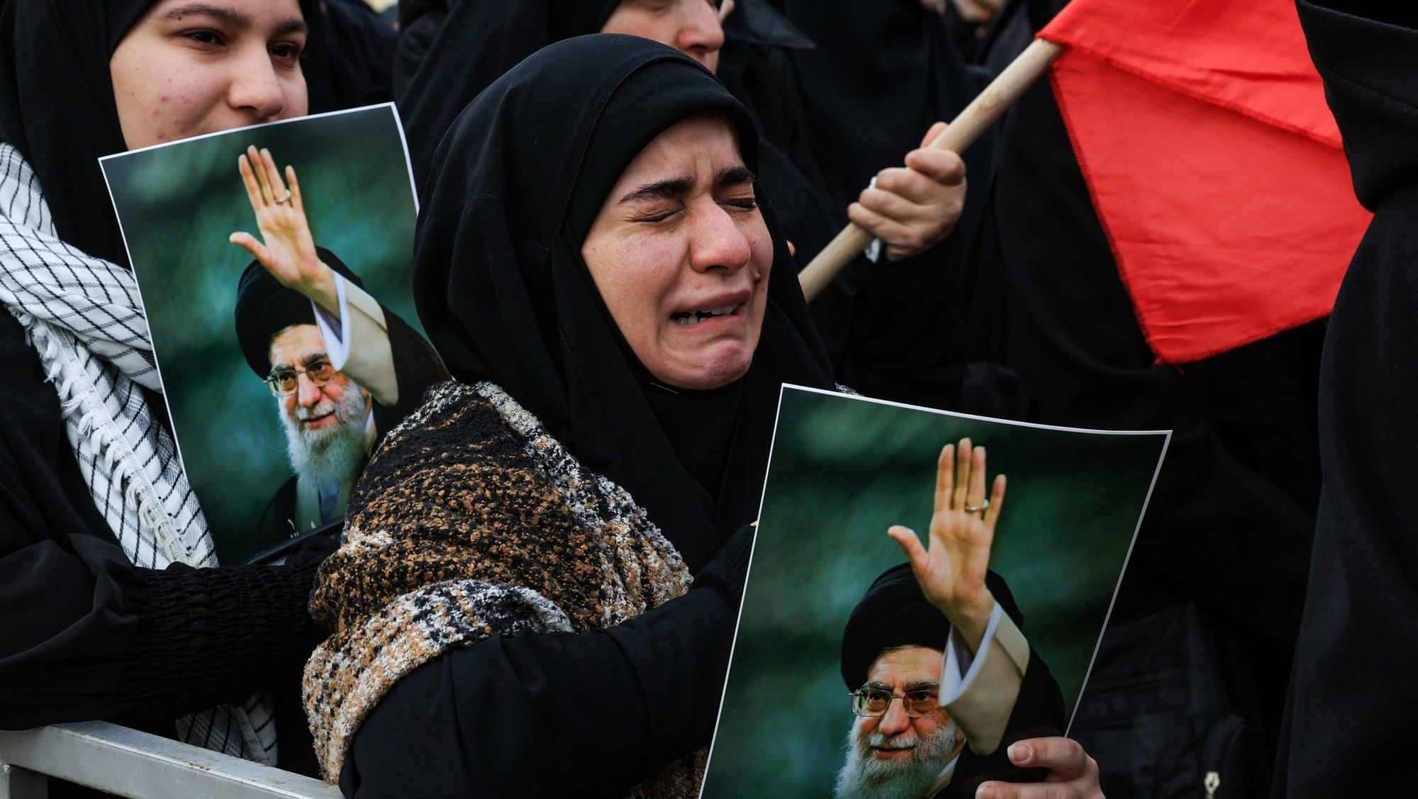 A woman reacts as she holds an image of Iranian late Supreme Leader Ayatollah Ali Khamenei at a rally in Beirut March 1, after U.S. and Israeli strikes killed him Feb. 28. (OSV News/Mohamed Azakir, Reuters)