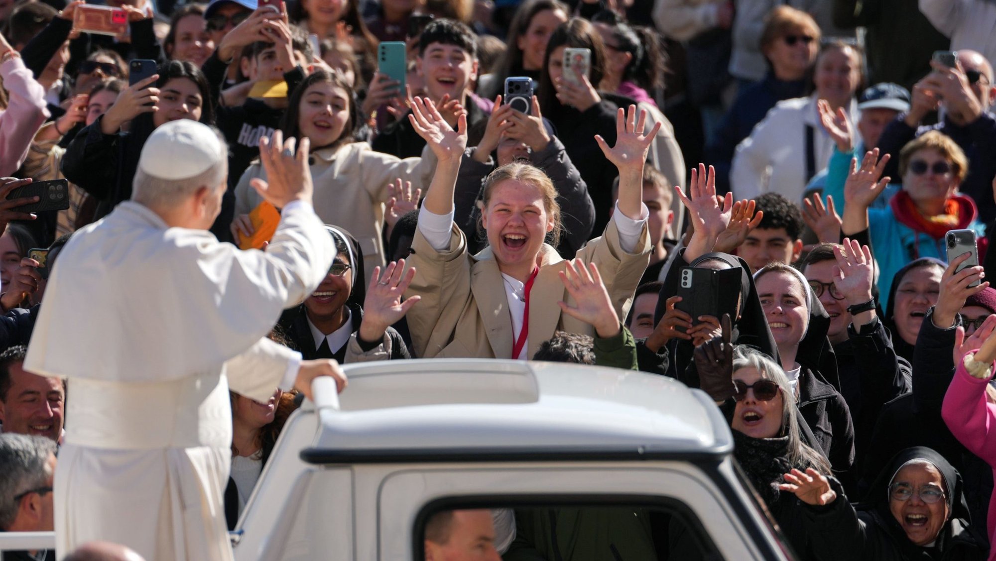 Pope Leo XIV greets visitors and pilgrims from the popemobile while riding around St. Peter’s Square at the Vatican before his weekly general audience March 18, 2026. (CNS photo/Lola Gomez)
