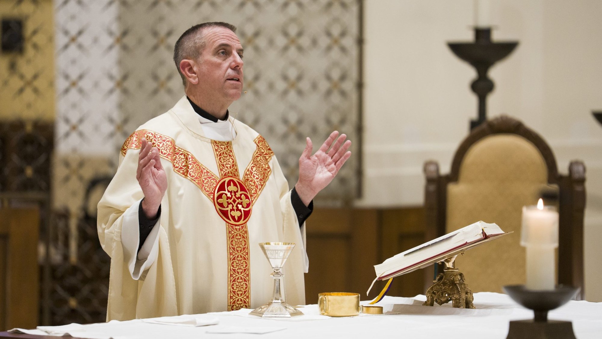 Jesuit Father Chris Collins, outgoing vice president of the University of St. Thomas in St. Paul, Minn., and parochial administrator of St. Peter Claver Church, celebrates Mass of healing for the St. Thomas community in the Chapel of St. Thomas Aquinas Jan. 27, 2026. A federal judge ruled March 20 that clergy must be allowed to provide spiritual care inside an ICE facility in Minneapolis, siding with an ecumenical group of Minnesota clergy, which included Father Collins, who filed suit in February after being barred from accessing the facility multiple times. (OSV News photo/Mark Brown, courtesy University of St. Thomas)