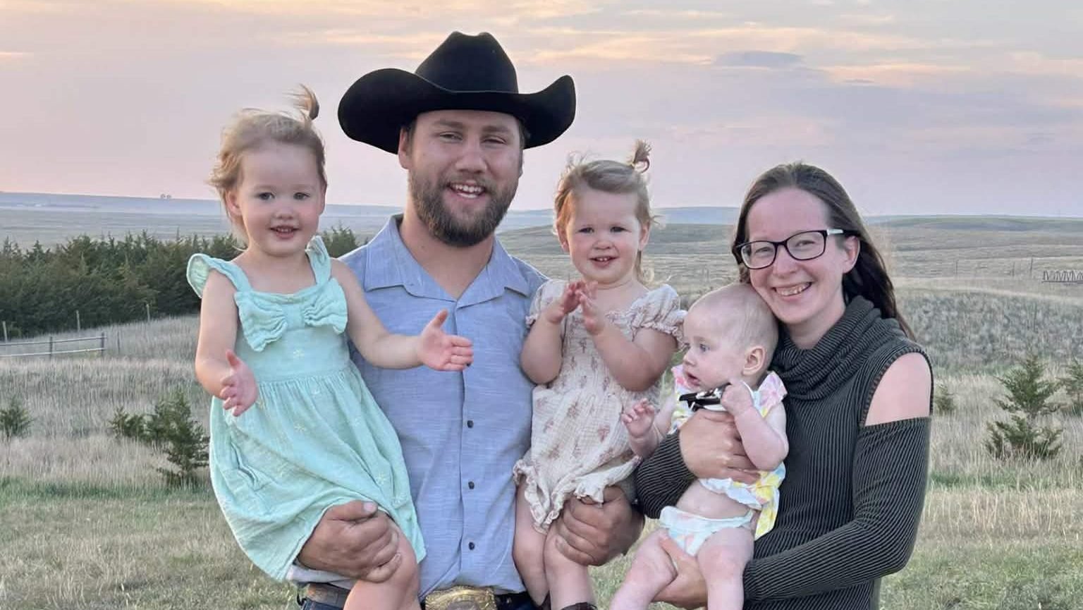 Wyatt and Andrea Artz, are pictured in an undated photo with their three children Roselyn, Adeline and Catherine outside their home in Gann Valley, S.D. As a fourth grader, Andrea Artz remembers praying that she would experience a Eucharistic miracle one day. She never imagined that, years later, she might witness one with her newborn daughter Catherine. (OSV News photo/courtesy Artz family)