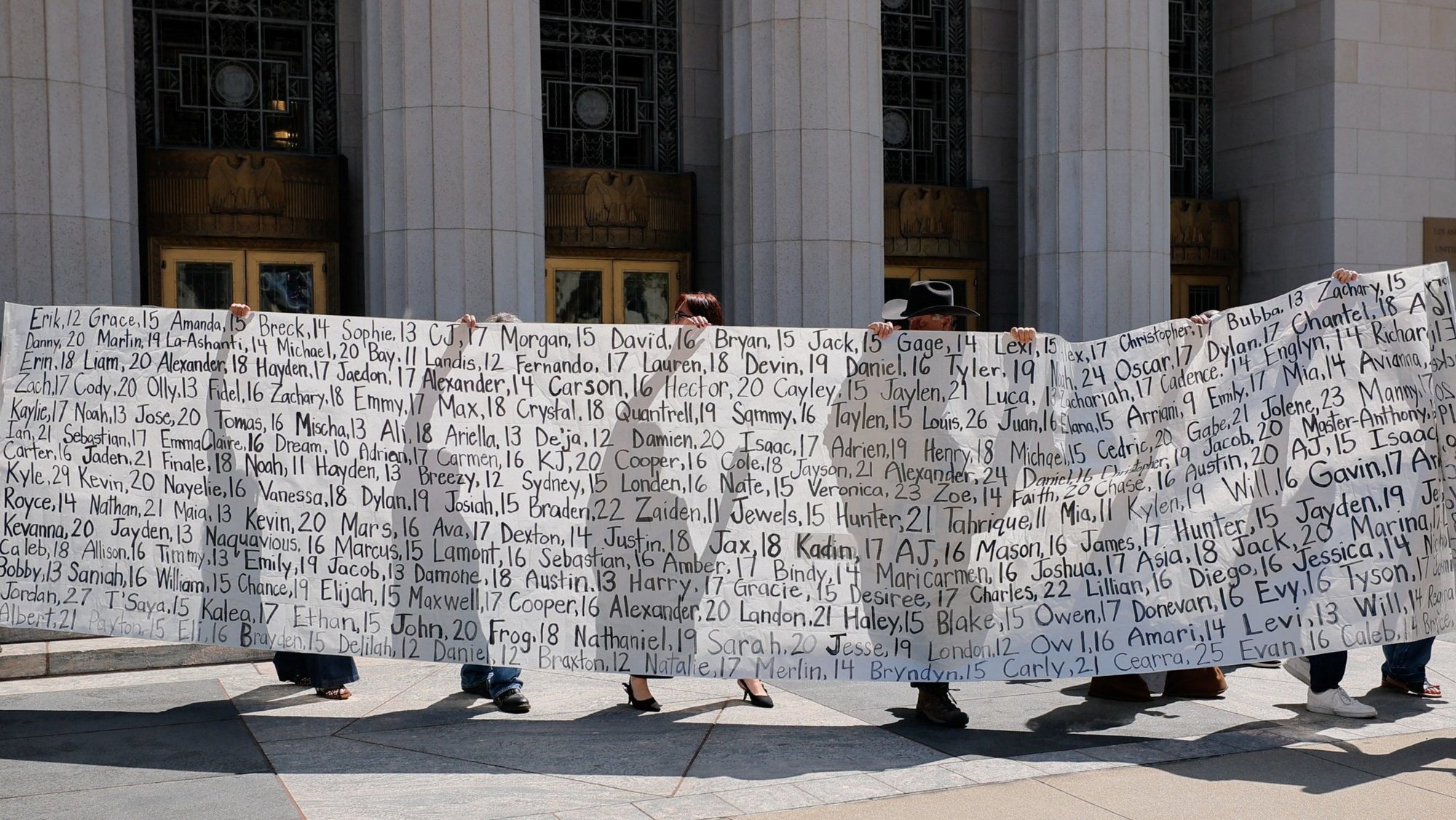 Parents who say they have lost their children due to social media hold up a banner with the children's names outside a Los Angeles court March 25, 2026, after the jury found Meta and Google liable in a key test case accusing Meta and Google's YouTube of harming children's mental health through addictive social media platforms. (OSV News photo/Mike Blake, Reuters)