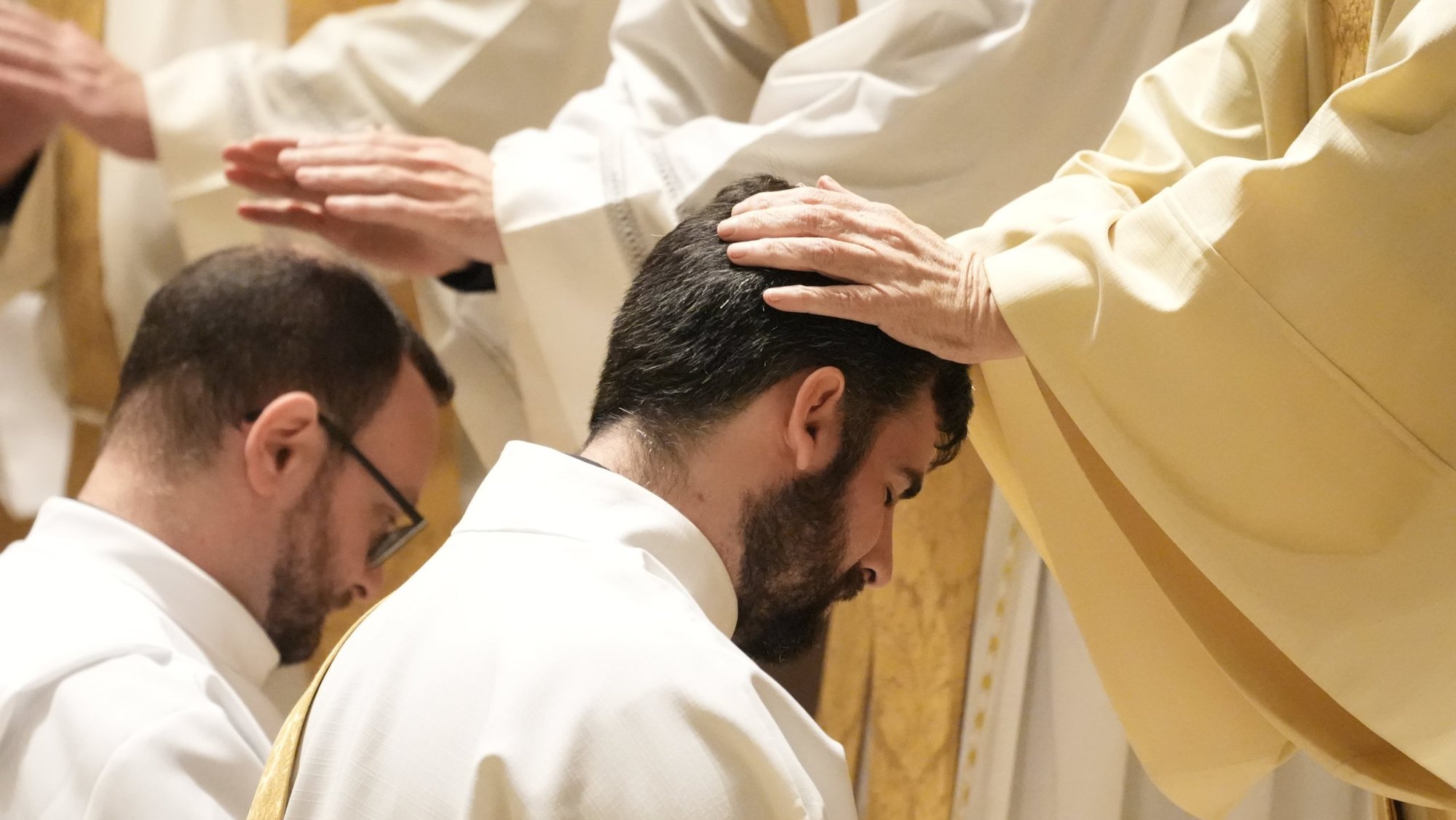 A priest lays hands on Deacon Kieran Halloran during his ordination to the priesthood at St. Ignatius Loyola Church in New York City June 14, 2025. A new report from the Center for Applied Research in the Apostolate at Georgetown University, conducted for the U.S. bishops, looks at the defining features of the more than 400 men who will be ordained to the priesthood in 2026. (OSV News photo/Gregory A. Shemitz)