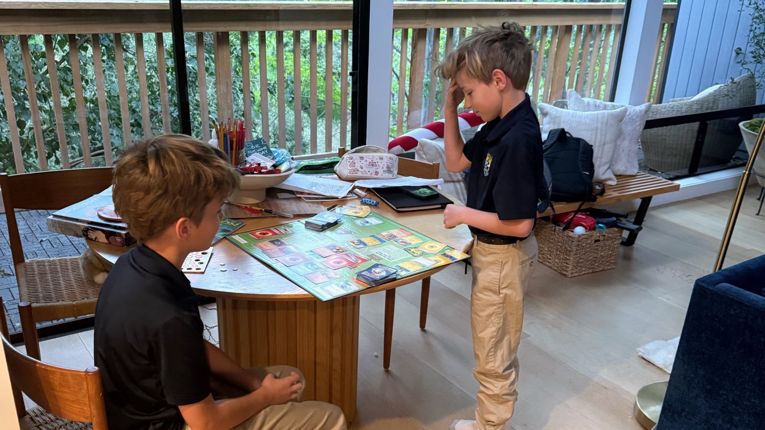 Students Beau and Lane McCutchen play a board game before school instead of spending time on screens. St. Martin of Tours School in Brentwood asked its students to “fast” from technology during Lent in 2026. (St. Martin of Tours School)