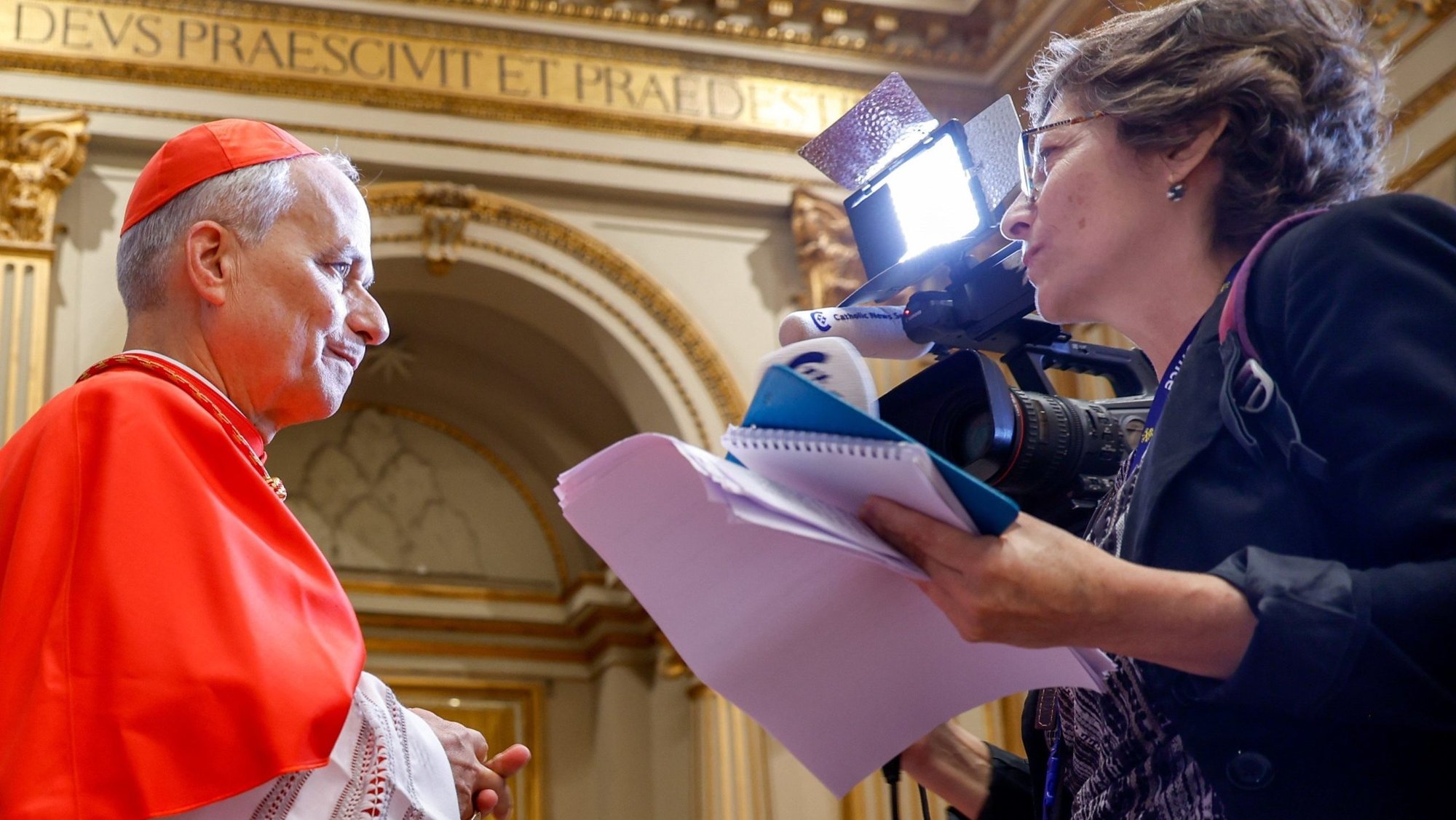 Carol Glatz, a veteran journalist at Catholic News Service in Rome, is pictured during an interview with then-Cardinal Robert F. Prevost in the Apostolic Palace at the Vatican after Pope Francis made him a cardinal Sept. 30, 2023. (CNS photo/Lola Gomez)