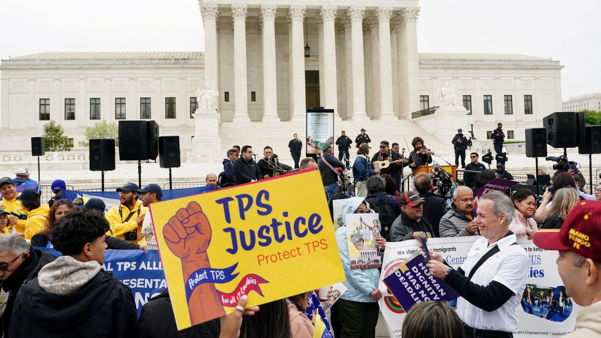 Immigrants' rights activists and demonstrators attend a rally outside the U.S. Supreme Court in Washington April 29, 2026, as justices hear arguments on whether the administration of U.S. President Donald Trump can end the Temporary Protected Status of Syrian and Haitian nationals. (OSV News photo/Nathan Howard, Reuters)