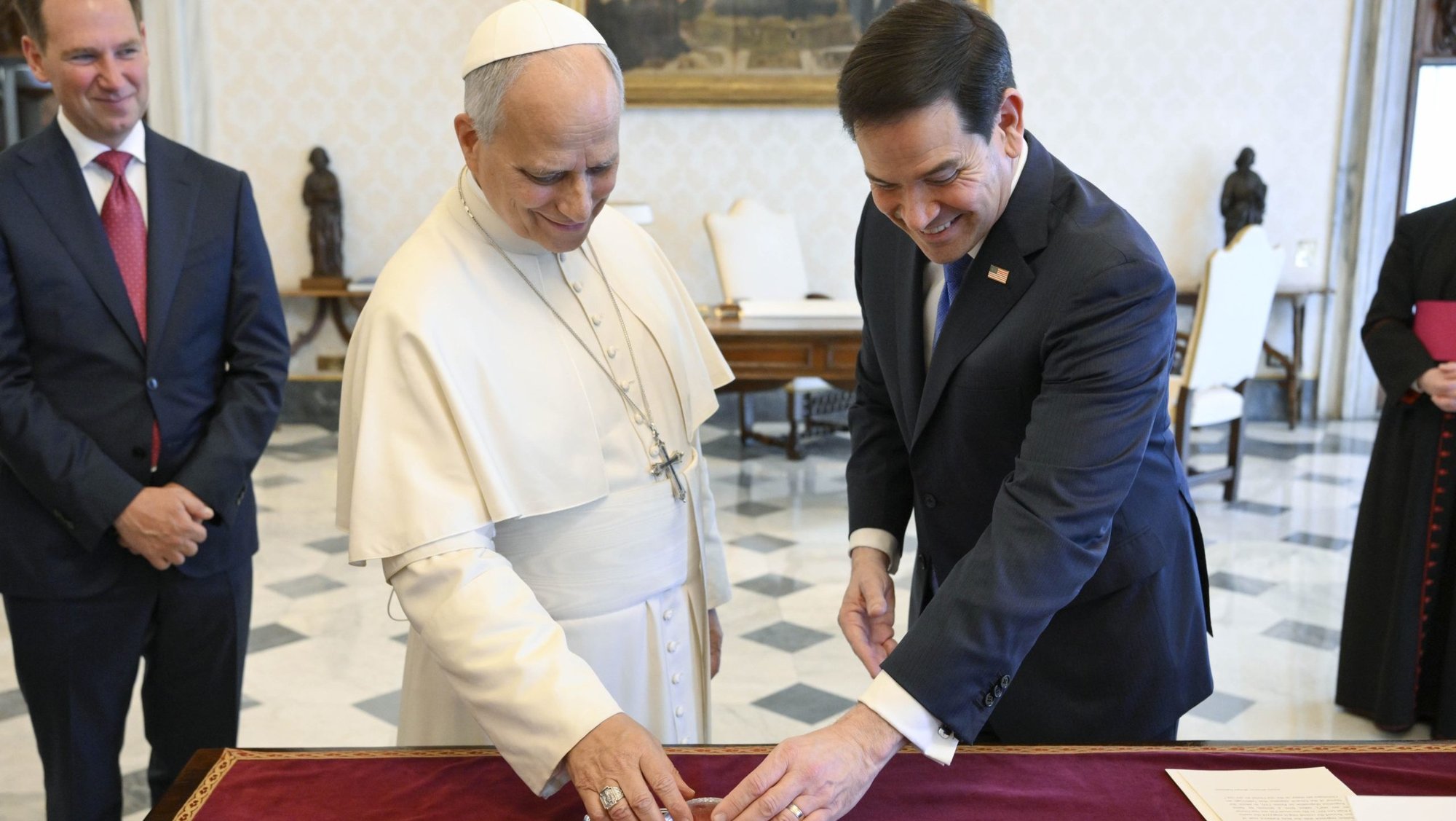 Pope Leo XIV exchanges gifts with U.S. Secretary of State Marco Rubio during a private audience at the Vatican May 7.(OSV News/Matteo Pernaselci, Vatican Media)