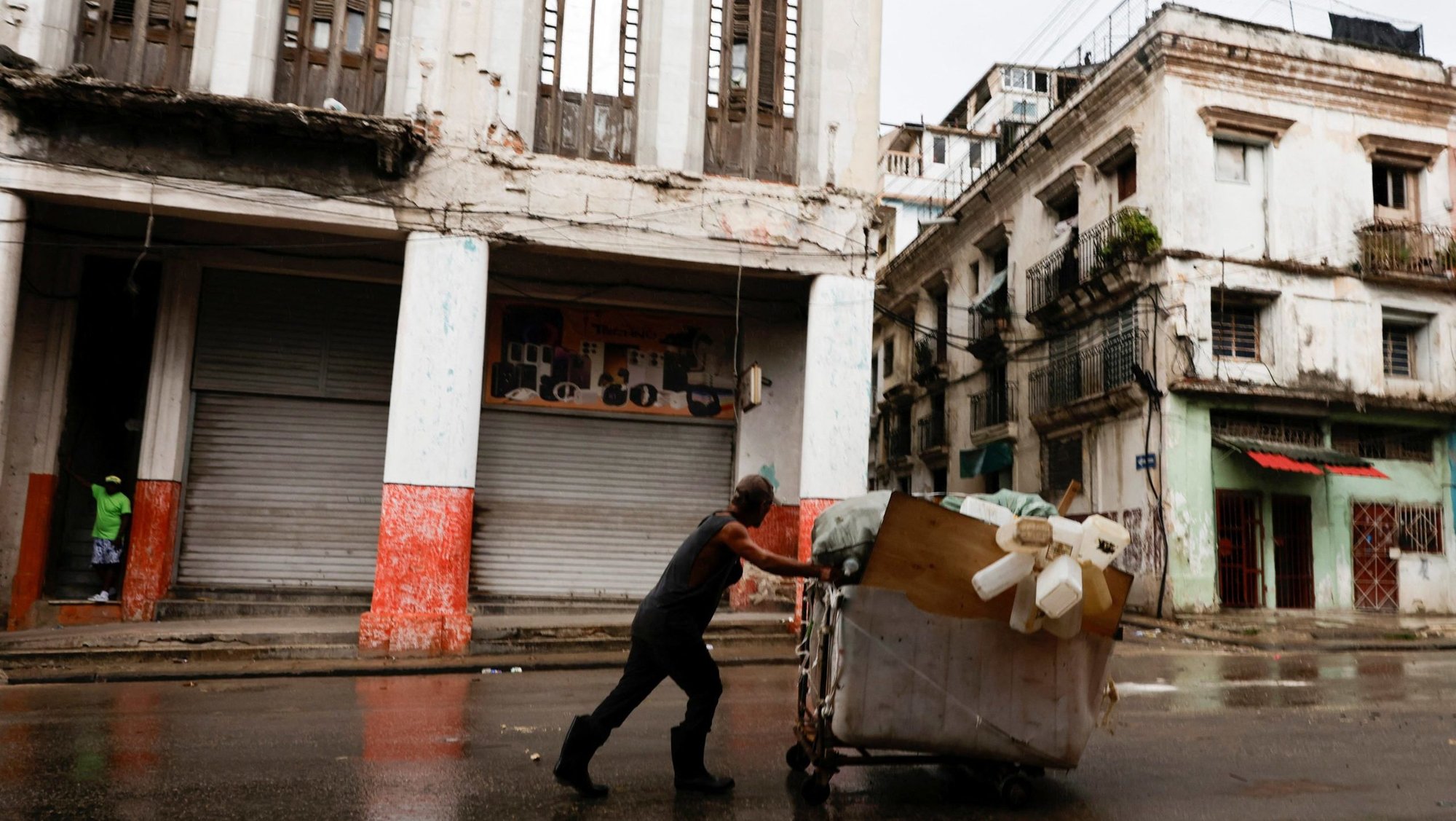 A man pushes a wheelbarrow loaded with collected plastic containers in Havana June 8, 2026. The Cuban government on June 18 announced far-reaching economic measures that could mark the most significant shift toward a market economy since the 1959 revolution. (OSV News photo/Norlys Perez, Reuters)