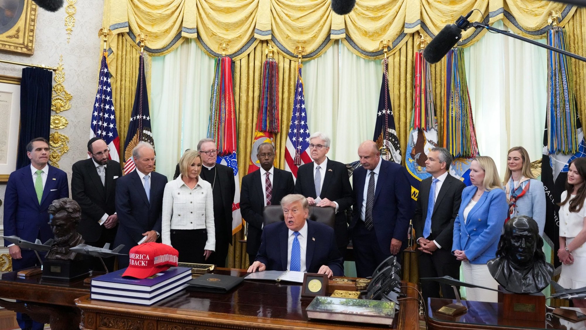 U.S. President Donald Trump speaks as the Department of Justice's Religious Liberty Commission presents a draft of its report to him in the Oval Office of the White House in Washington, June 26, 2026. (OSV News photo/Ken Cedeno, Reuters)