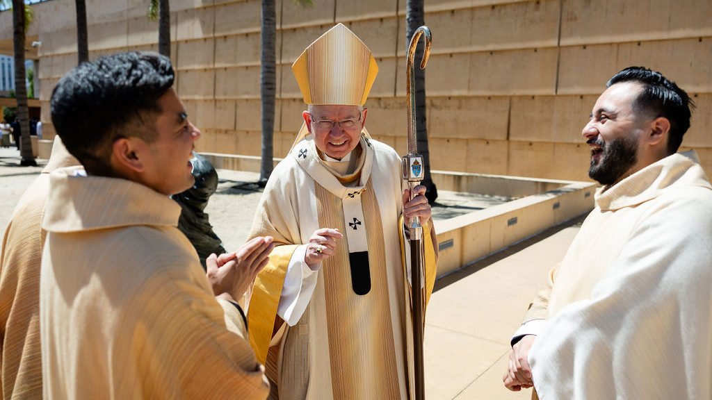 Archbishop José H. Gomez shares a moment with new priests Father Shengda “Martin” Zhu, Father Jerick Alenton, and Father David Zamora after their ordination Mass May 30. (Joe Garcia III)