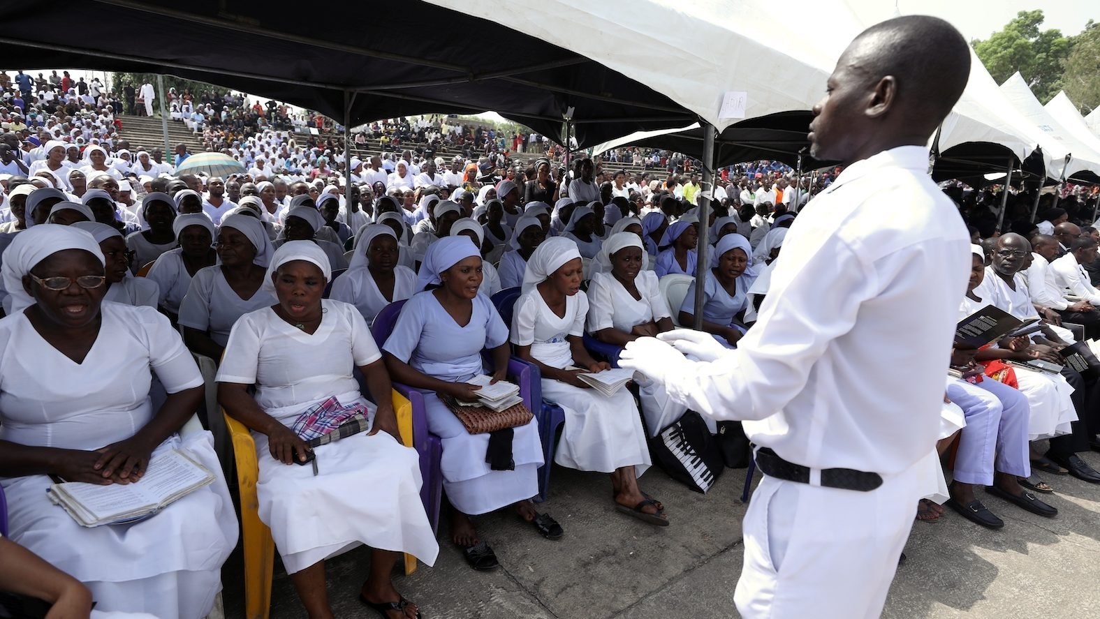 A Catholic choir sings during the funeral Mass Jan. 11 for people killed by Fulani herdsmen in Makurdi, Nigeria. With at least 80 people killed since the start of the year in conflict over fertile land in Nigeria, the nation's bishops condemned what they call brutal massacres of innocent people. (CNS photo/Afolabi Sotunde, Reuters) See NIGERIA-BISHOPS-MASSACRES Jan. 18, 2018.