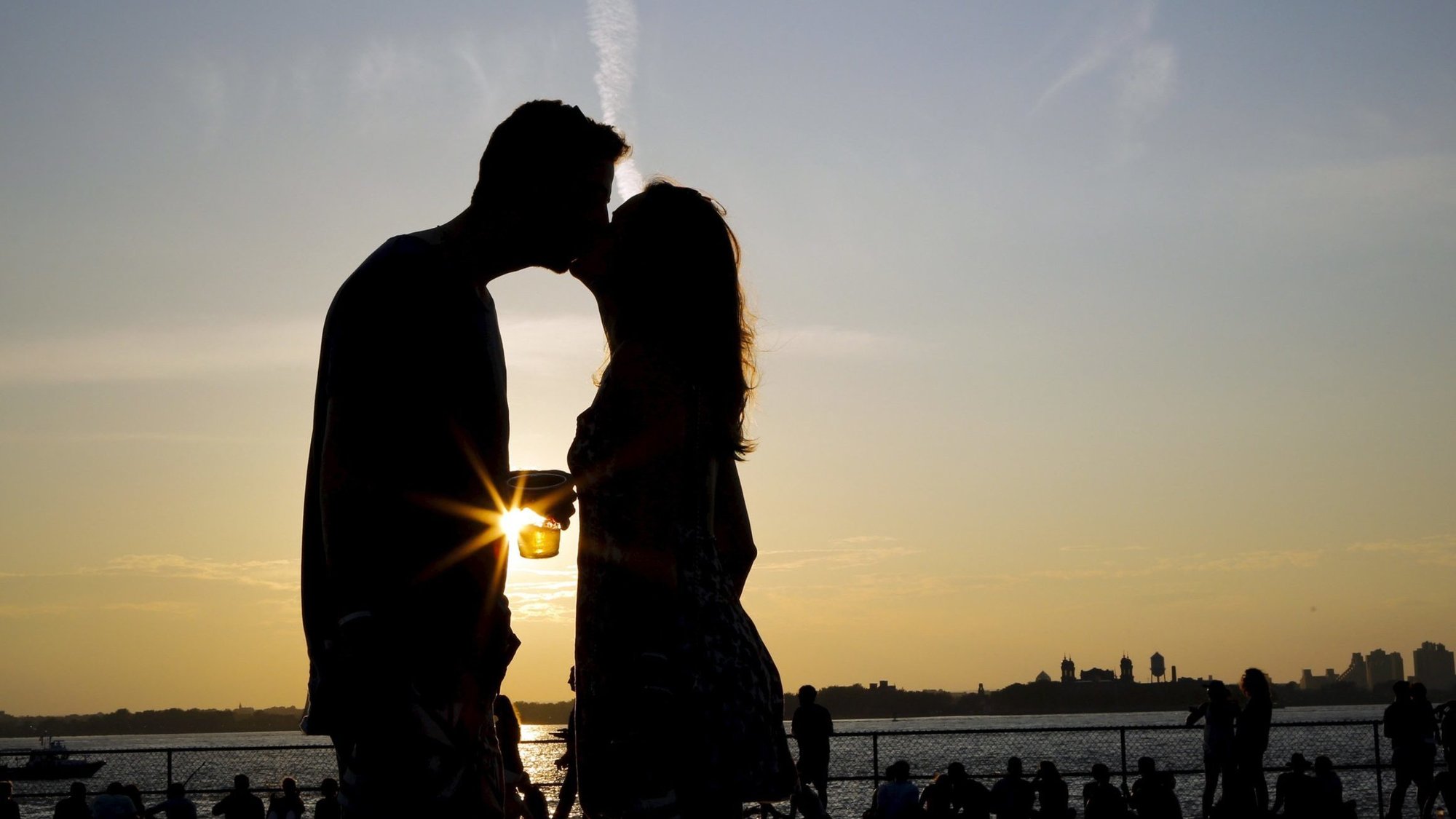 A file photo shows a young couple kissing while they enjoy a sunny afternoon at Governors Island in New York City. (OSV News photo/Eduardo Munoz, Reuters)