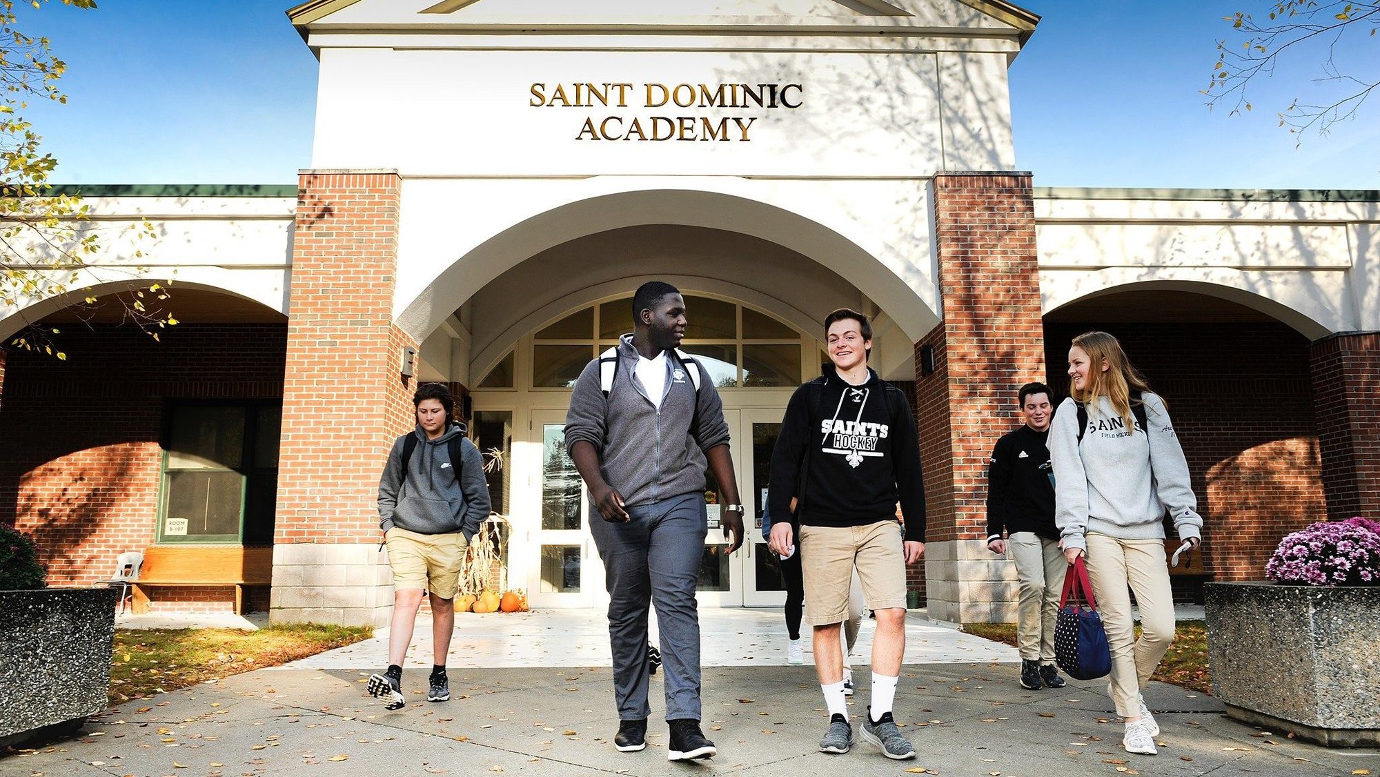 Members of the Keith and Valori Radonis family are pictured in front of St Dominic Academy in Portland, Maine, in an undated photo. A federal judge ruled Aug. 8, 2024, that Catholic schools can be excluded from Maine's tuition grant program. On June 13, 2023, the Radonis family and St. Dominic School filed a federal lawsuit suit challenging the exclusion of faith-based schools from a state tuition assistance program. (OSV News photo/courtesy Diocese of Portland, Maine)