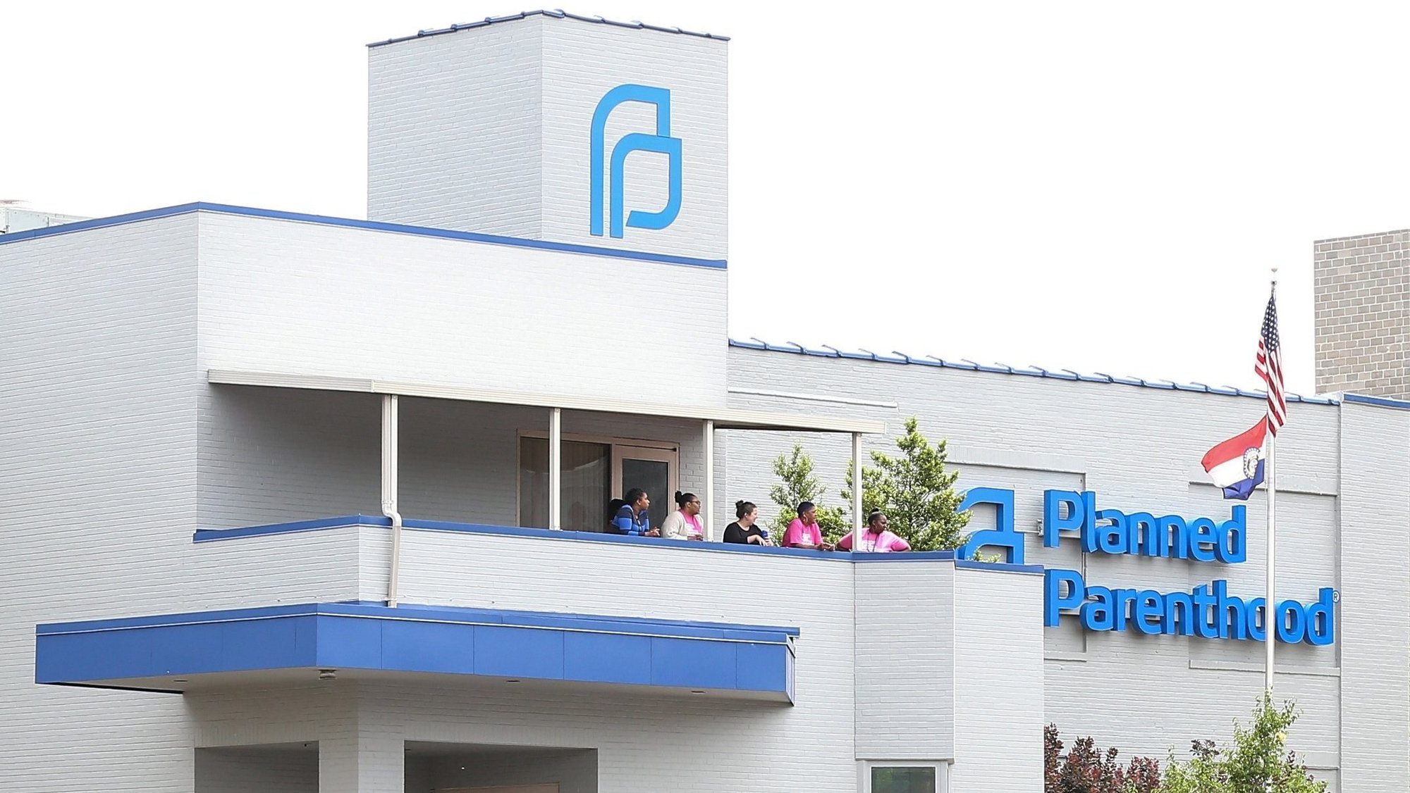 Planned Parenthood employees stand outside the facility during protests in St. Louis May 31, 2019. Federal funding for Planned Parenthood resumed July 5, 2026, after a provision of the One Big Beautiful Bill prohibiting those funds expired on Independence Day. (OSV News photo/Lawrence Bryant, Reuters)