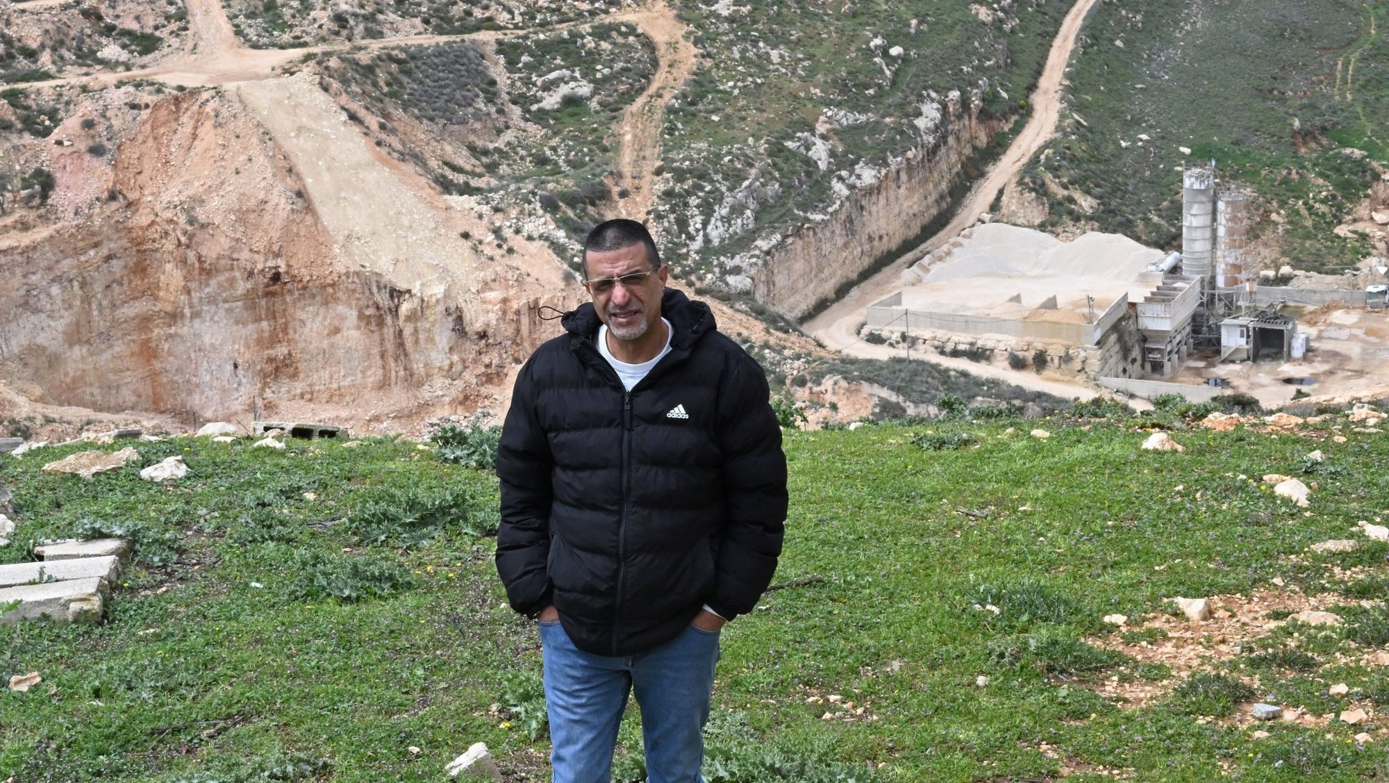 Palestinian Roland Bassir stands on a hill overlooking his and his brother's quarry in the Christian village of Taybeh, West Bank, March 23, 2026. Bassir said he has been unable to open his quarry since Israeli Jewish extremist settlers took control of the area, threatening him with violence if he comes to work in the quarry he has owned for 20 years. (OSV News photo/Debbie Hill)