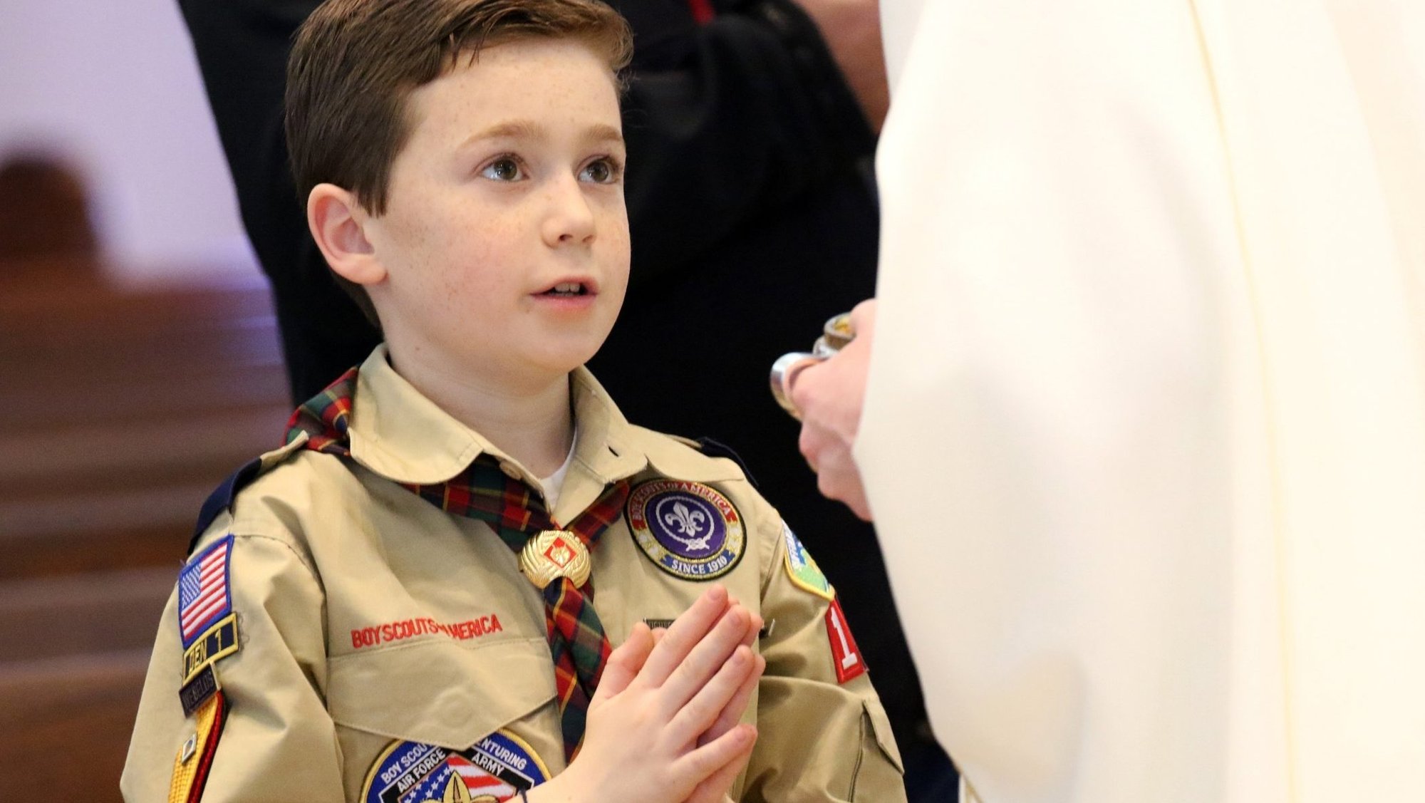 A Scout is pictured in a file photo receiving Communion during Mass while participating in Cub Scout Fun and Faith Day at St. Patrick Church in Smithtown, N.Y. (OSV News photo/Gregory A. Shemitz, Long Island Catholic)