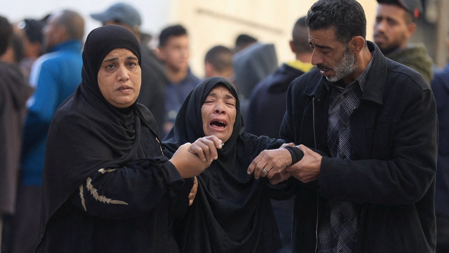 Mourners react as they attend a funeral Dec. 3, 2025, in Gaza City for Palestinians who, according to medics, were killed in an Israeli airstrike at Al-Ahli Arab Baptist Hospital. Late July 29, 2026, an Israeli airstrike on a residential apartment directly adjacent to the CNEWA-supported hospital in the center of Gaza City damaged hospital facilities. (OSV News photo/Dawoud Abu Alkas, Reuters)