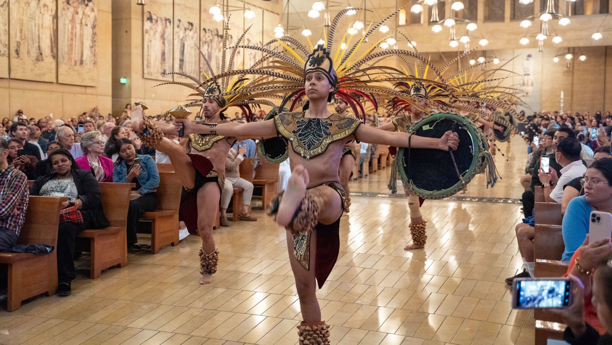 Dancers from Grandeza Mexicana Folk Ballet Company file into the Cathedral of Our Lady of the Angels to kick off the event. (Reese Cuevas)