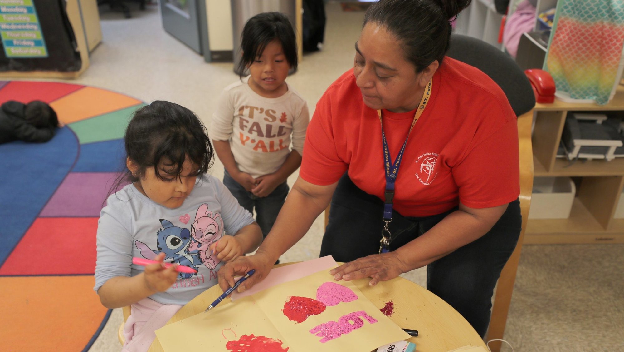 Pre-K teacher Juile Sabori works with Juilana Ruiz and Kyra Sebastian, back, in the classroom at St. Peter Indian Mission Catholic School on the Gila River Indian Reservation in Bapchule, Ariz., Feb. 13, 2026. The school is a mission of the Franciscan Sisters of Christian Charity of Manitowoc, Wis., and was established in 1923. (OSV News photo/Bob Roller)
