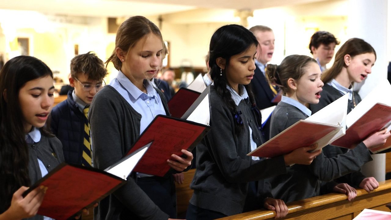 Students are seen in a Jan. 21, 2026, photo, singing during Mass at Regina Pacis Academy in Norwalk, Conn. Regina Pacis Academy, a preschool-to-eighth-grade independent Catholic school, was founded as a tech-free classical school. Instead of smartboards, devices and a computer lab, the academy has chalkboards, textbooks and a well-stocked library, said Kimberly Quatela, its principal. (OSV News photo/courtesy Regina Pacis Academy)