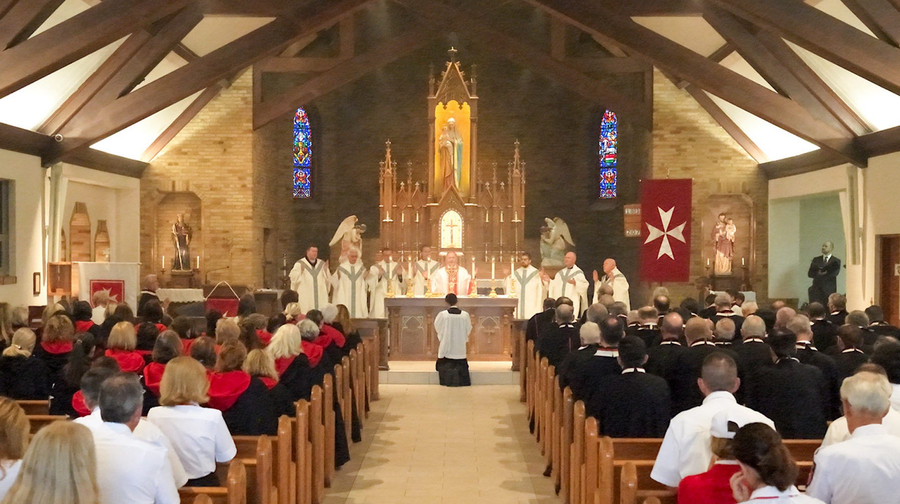 Members of the Order of Malta attend Mass during the organization’s annual pilgrimage in August to the National Shrine of Our Lady of Champion in Wisconsin. (Keith Farley)