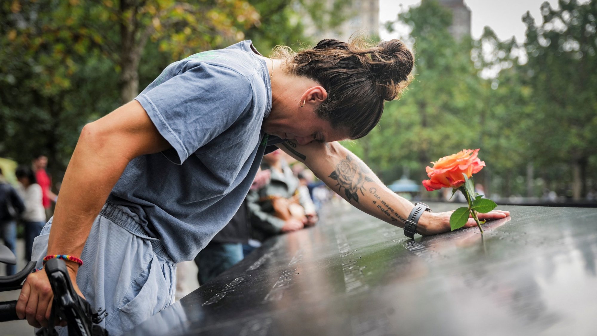 Elizabeth Adams reacts at the 9/11 Memorial & Museum reflecting pool in the Manhattan borough of New York City, Sept. 10, 2025, ahead of the 24th anniversary of the Sept. 11, 2001, attacks on the World Trade Center. (OSV News/Jeenah Moon, Reuters)