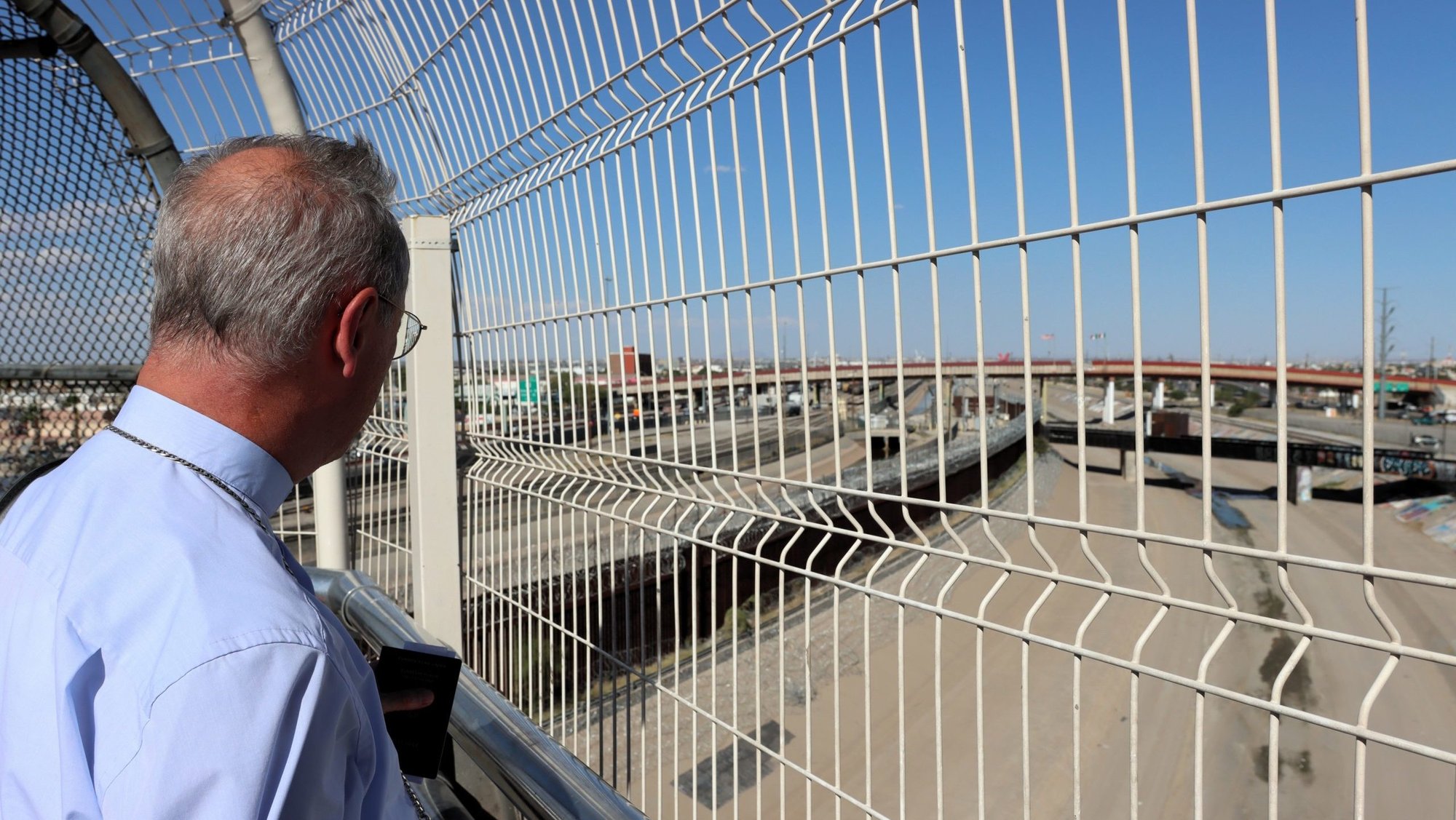 Archbishop Stefan Hesse of Hamburg, who is the special representative for refugee issues for the German Bishops' Conference, looks through the U.S.-Mexico border fence Aug. 25, 2026, after returning from Ciudad Juárez, Mexico, to El Paso, Texas. (OSV News photo/Daniela Elpers, courtesy German Bishops Conference)