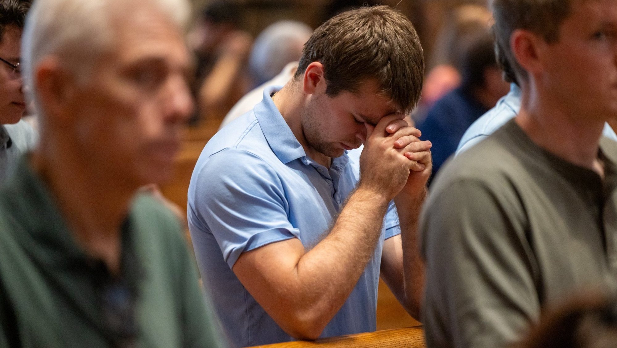 A young man prays during a Labor Day Mass on Sept. 6, 2026, at the Cathedral of St. Matthew the Apostle in Washington. The Mass organized by the Catholic Labor Network included parishioners, workers and representatives of organized labor. (OSV News photo/Mihoko Owada, Catholic Standard)