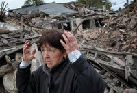 A woman stands at a site of her in-laws' house on the outskirts of Dnipro, Ukraine, Oct. 19, 2026, that was destroyed in a Russian airstrike. (OSV News photo/Reuters)