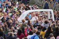 Pope Leo XIV smiles from the popemobile while riding around St. Peter’s Square at the Vatican before his weekly general audience Oct. 21, 2026. (CNS photo/Lola Gomez)