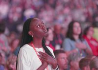 A young woman prays