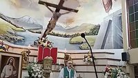 A large wooden crucifix is seen falling in this screenshot from video as Redemptorist Father Patricio Alfredo Sánchez Molinari celebrates Mass Oct. 17, 2026, at Our Lady of Perpetual Help Church in Guayaquil, Ecuador. The crucifix struck Father Sánchez directly on the head, killing him almost immediately. (OSV News/Church of Perpetual Relief in Guayaquil livestream video)