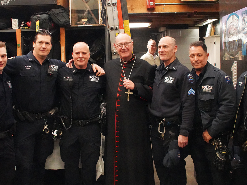 Cardinal Dolan Celebrates Mass for NYPD Precinct 13 on Christmas Eve