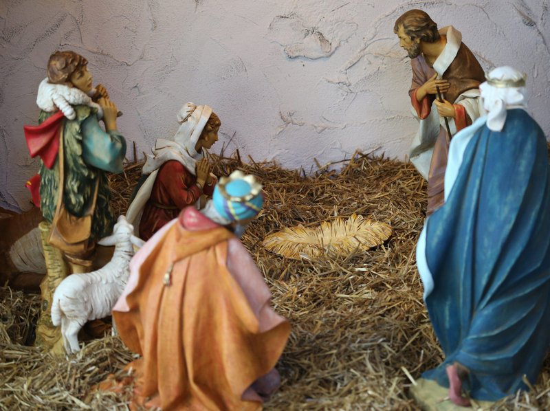An empty crib is seen in a Nativity Dec. 19 at the headquarters of U.S. Conference of Catholic Bishops in Washington. During Pope Francis' Dec. 19 morning homily, he asked people to pray before the empty Christmas crib during the last days of Advent and say, "Come Lord, fill the crib, fill my heart and encourage me to give life, to be fruitful." (CNS photo/Bob Roller)