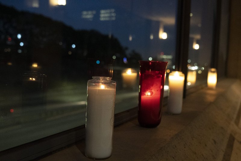 Candles were lit in support of medical workers and their families along the edge of the Cathedral of Our Lady of the Angels plaza overlooking the 101 freeway in downtown Los Angeles. (Sarah Yaklic)