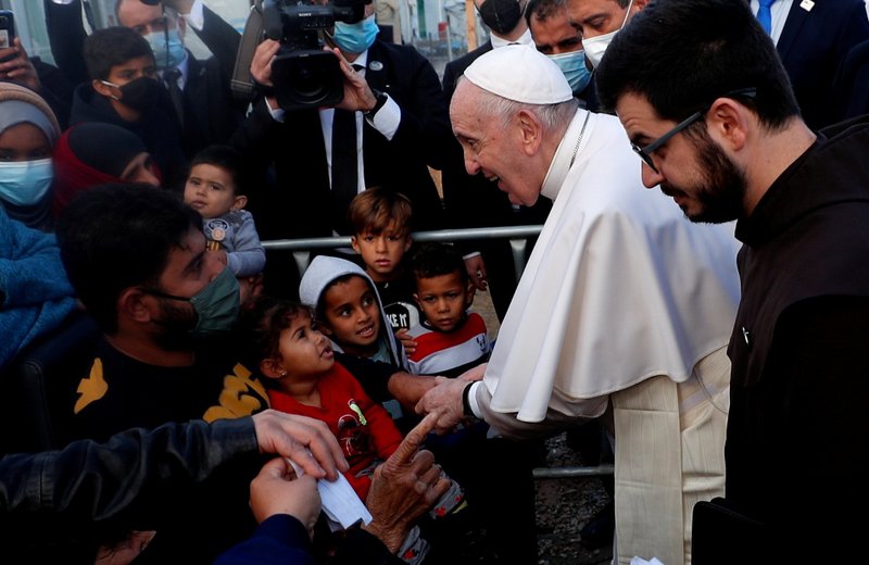 Pope Francis reacts as he meets migrants during his visit to the Mavrovouni camp for refugees and migrants on the island of Lesbos, Greece, Dec. 5, 2021. Pope Francis, formerly Argentine Cardinal Jorge Mario Bergoglio, died April 21, 2025, at age 88. (CNS photo/Guglielmo Mangiapane, Reuters)
