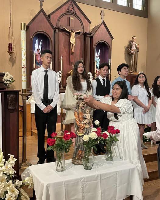 Young people at Holy Trinity Church in Atwater Village crown the Virgin Mary during a Mass. (Holy Trinity Church)